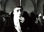 Ein ob der Ausführungen von Bruder William erschrocken wirkender Kopist im Skriptorium